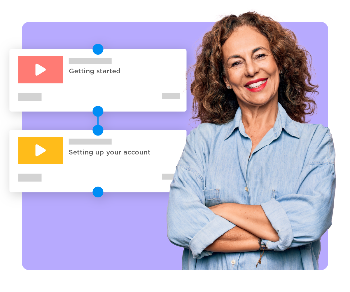 Smiling HR professional standing near two employee training videos connected in a workflow.